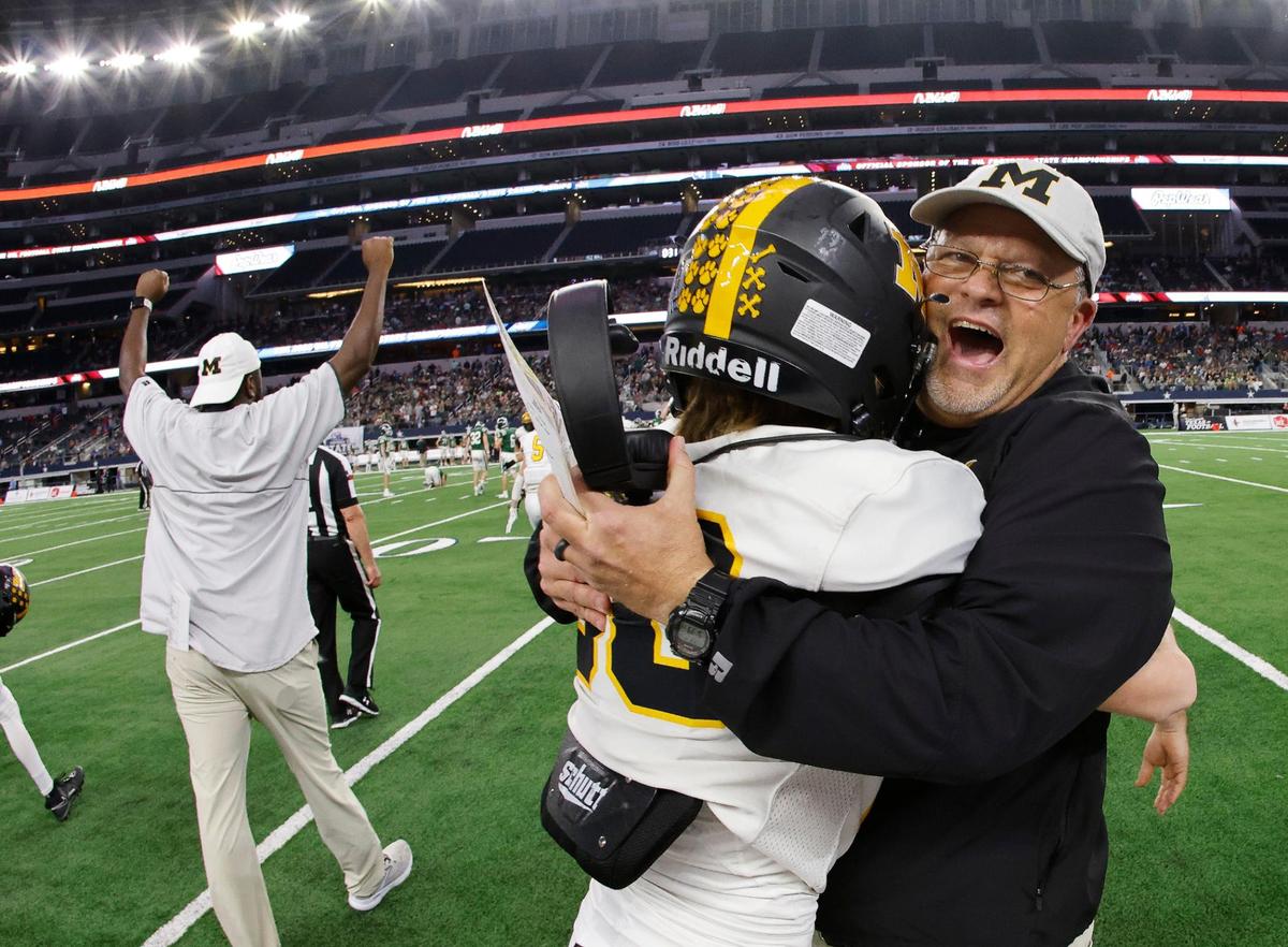 Malakoff head coach Jamie Driskell hugs a player after the UIL Conference 3A Division 1 state championship football game at AT&T Stadium in Arlington, Texas, Thursday, Dec. 14, 2023. Malakoff defeated Franklin 14-7.