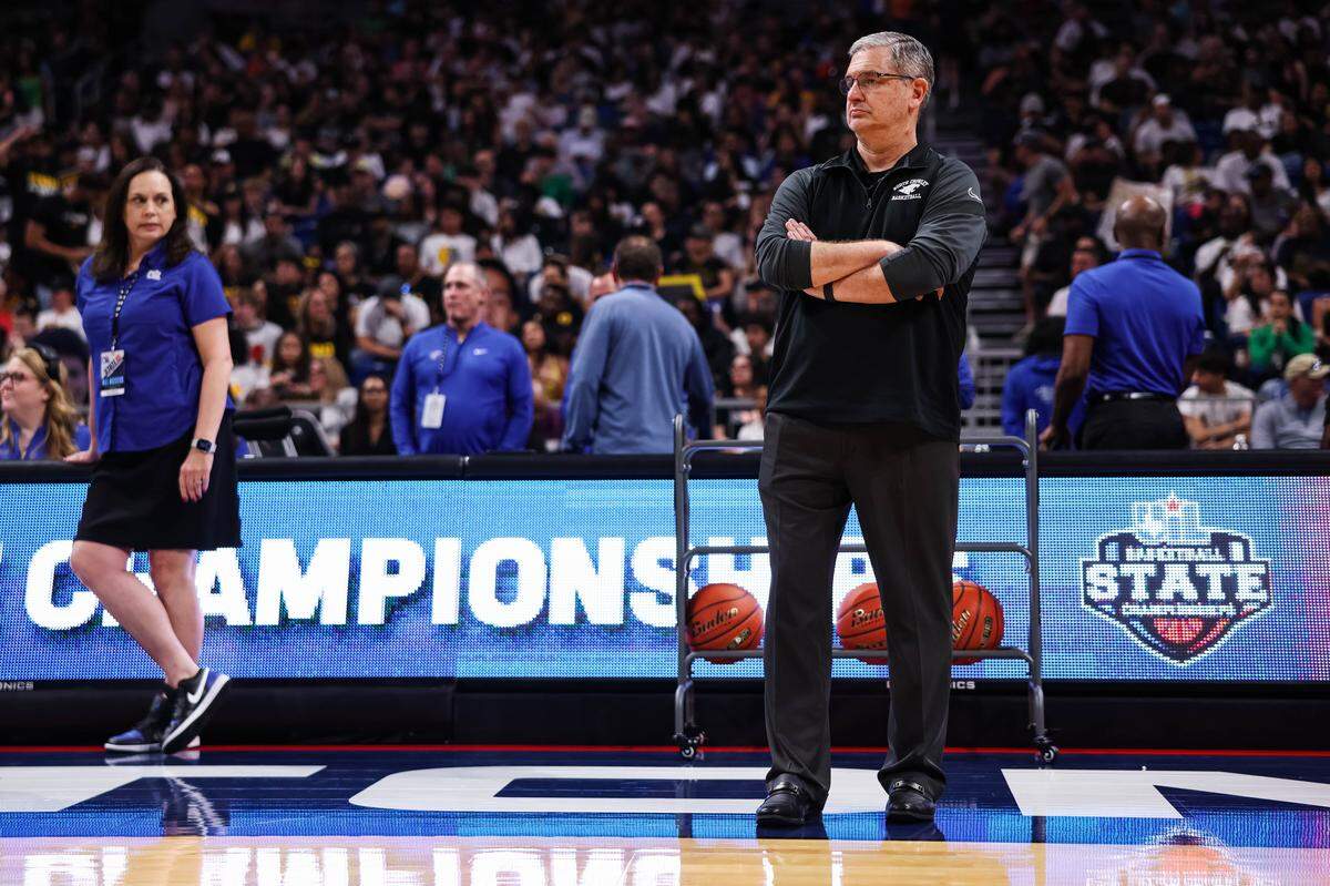 North Crowley head coach Tommy Brakel stands on the sideline as his team finishes warmups before the Class 6A Division I state championship against San Antonio Brennan on Saturday at the Alamodome in San Antonio.