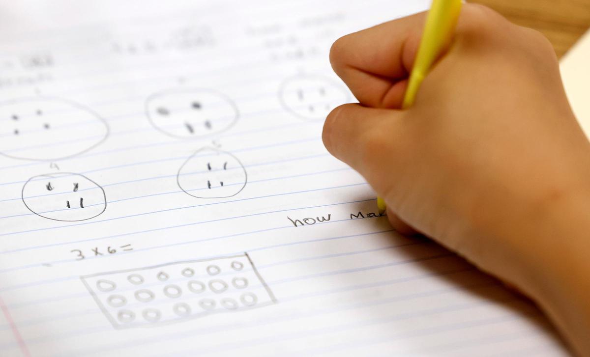 A child works on a math problem during a summer learning program at Rufino Mendoza Elementary School on June 12 in Fort Worth.
