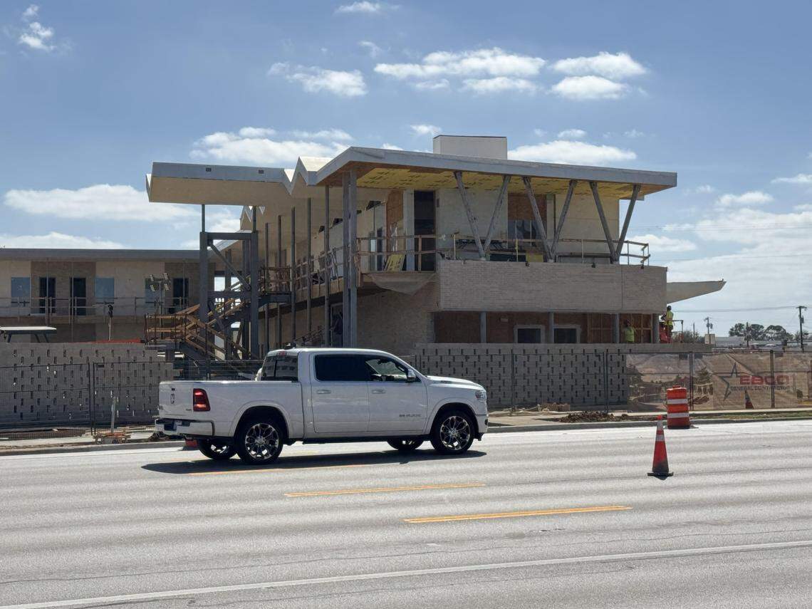 Construction crews working Tuesday, March 3, 2026, on a section of the original Caravan Motor Hotel that will open in spring 2026 as the new upscale Caravan Court Hotel.