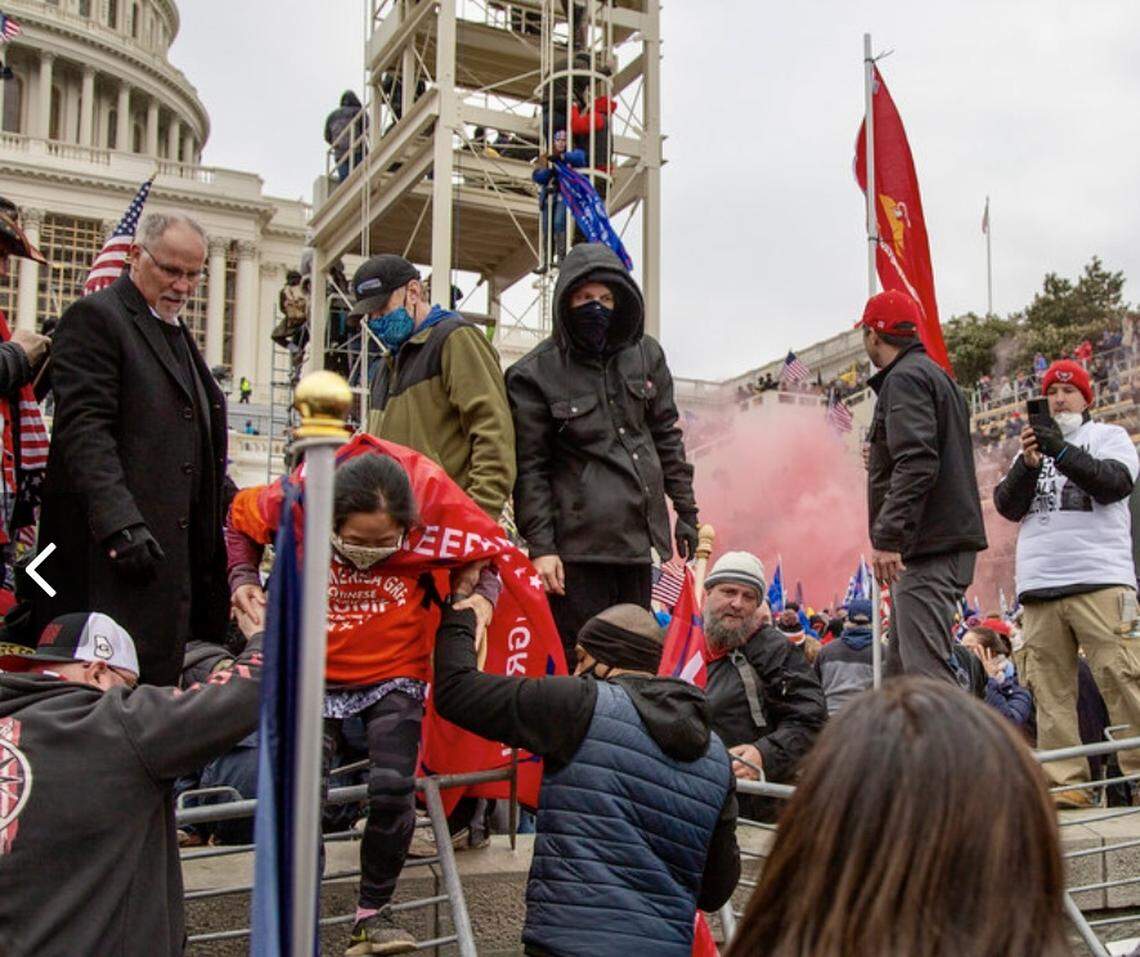 State Rep. Kyle Biedermann, left (R-Fredericksburg) in the crowd outside the U.S. Capitol Jan. 6, 2021.