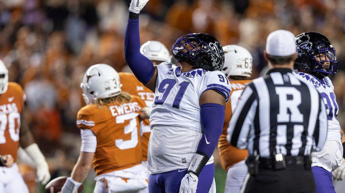 TCU defensive lineman Tymon Mitchell (91) celebrates a sack of Texas quarterback Quinn Ewers (3) earlier this season.