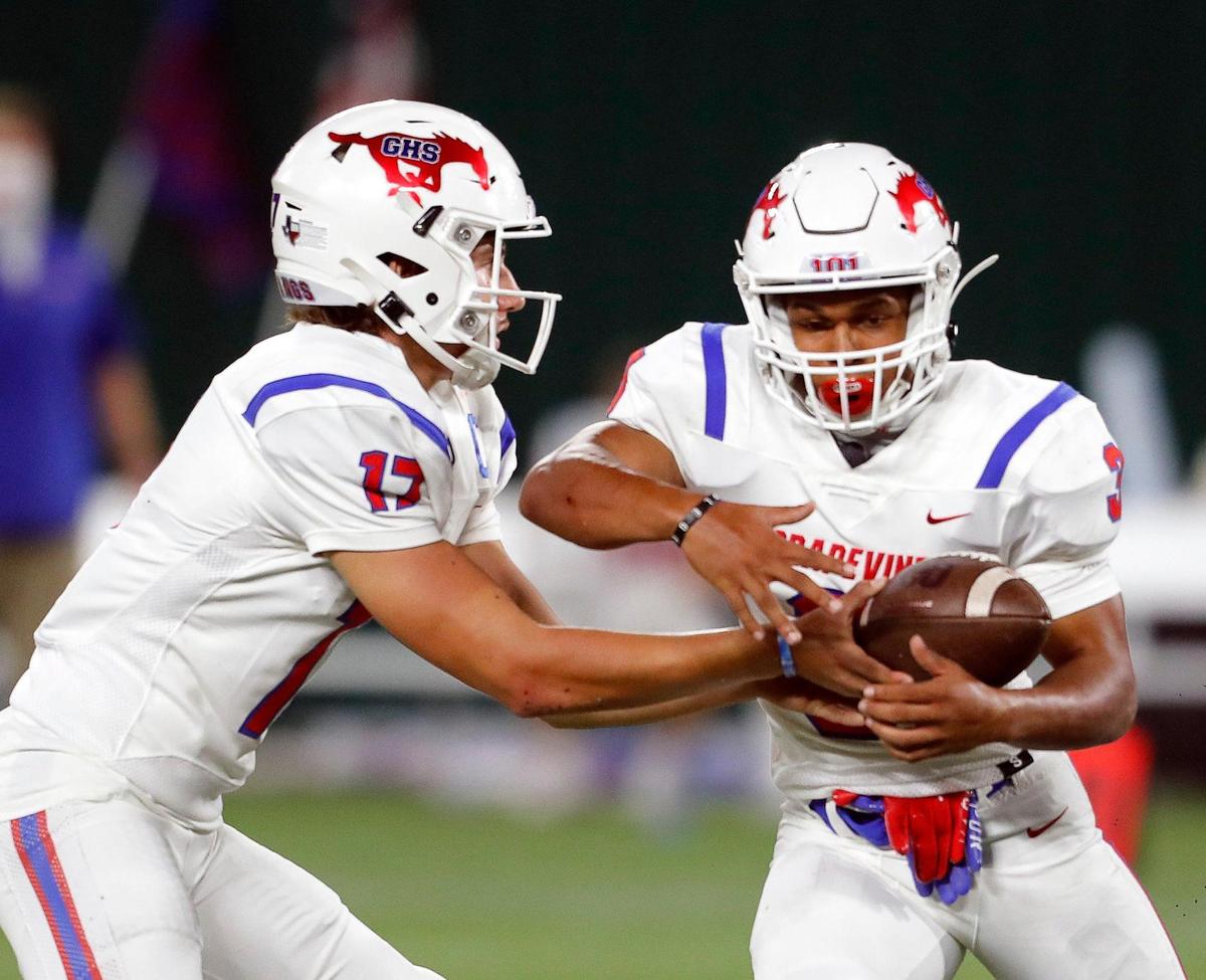 Grapevine quarterback Derek Engel (17) hands the ball to running back Caleb Texada (3) during a high school football game at Globe Life Park in Arlington, Texas, Saturday, Sept. 26, 2020. Colleyville led 28-24 at the half. (Special to the Star-Telegram Bob Booth)