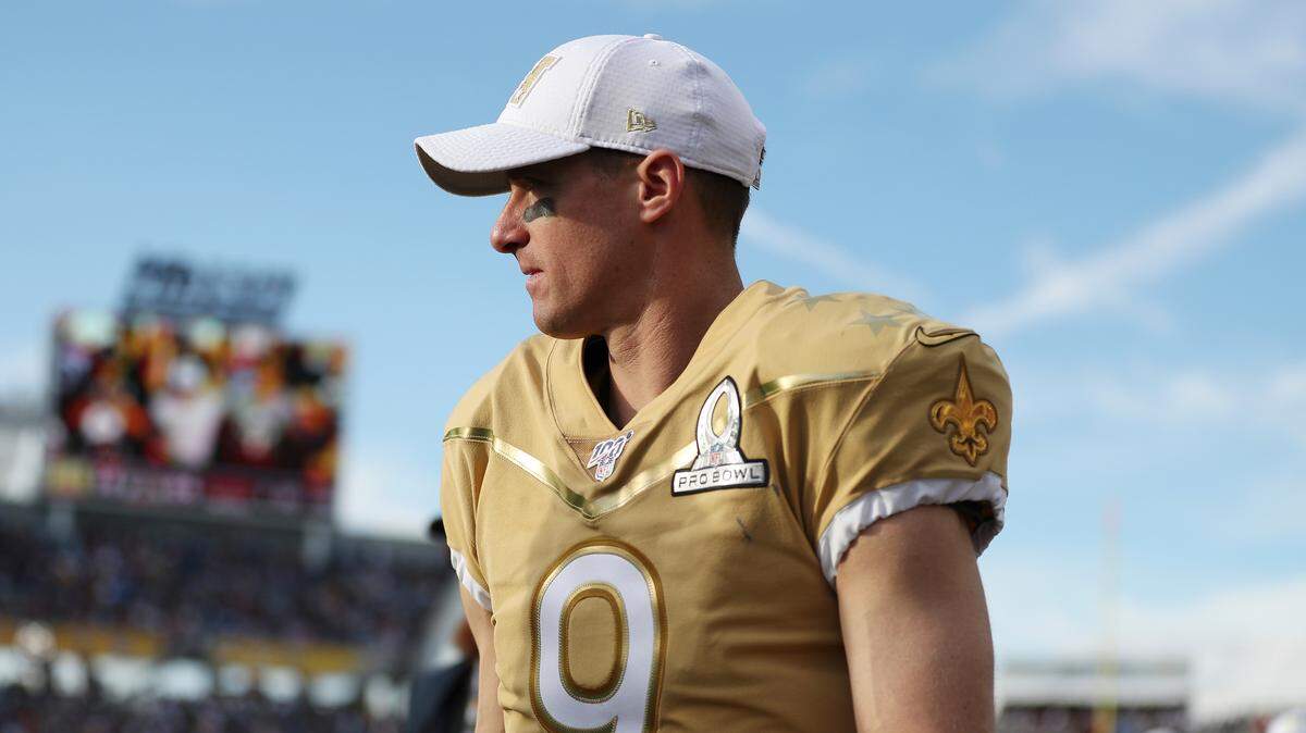 NFC quarterback Drew Brees, of the New Orleans Saints, walks off the field at halftime during the NFL Pro Bowl football game against the AFC, Sunday, Jan. 26, 2020, in Orlando, Fla. (AP Photo/Steve Luciano)