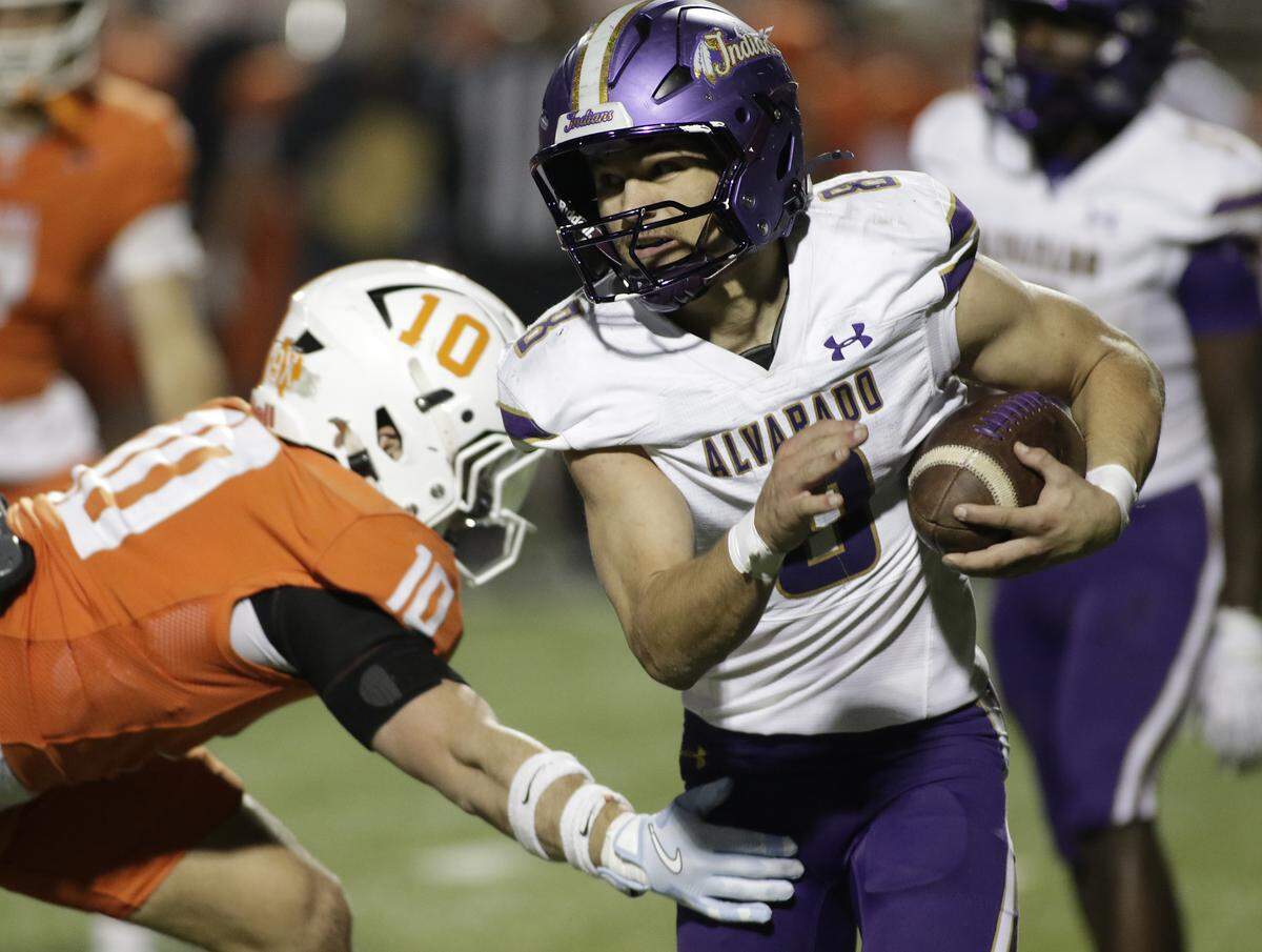 Alvarado’s DJ Clampitt breaks a tackle against Celina’s during their Class 4A Division I quarterfinal game at Newsom Stadium on Friday, December 5, 2025, in Mansfield, Texas.