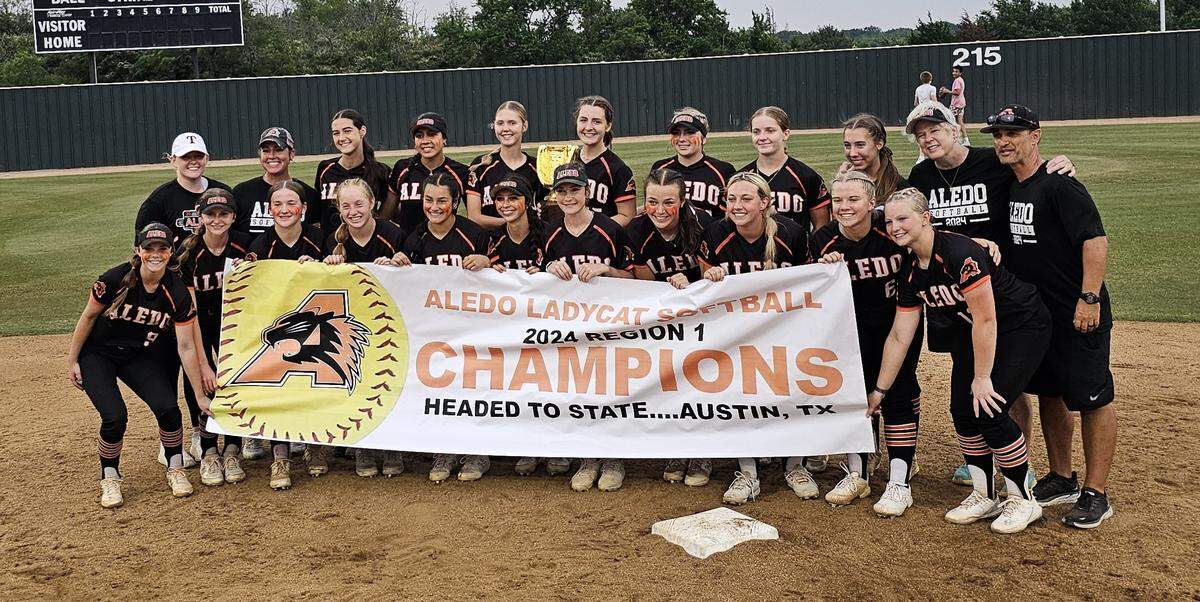 The Aledo softball team poses with the Class 5A Region I championship trophy after defeating Burleson Centennial 12-7 to sweep the series on Thursday, May 23, 2024 at Centennial High School in Burleson, Texas.