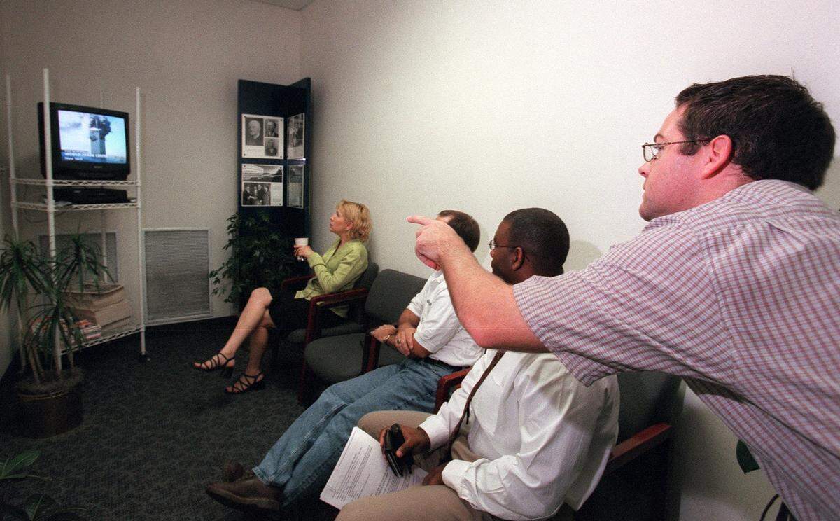Around 8:10 am on Sept. 11, 2001, at UTA's University Center: Valerie Goodwin, Kent Rawlak, Austin Lane and Chris Fulton watch a broadcast of a commercial plane that crashed into the World Trade Center’s Tower 2. At the early time very few people were aware of the crash.