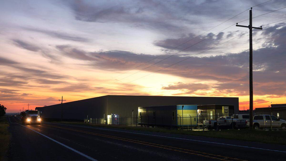 The sun rises on a cryptocurrency mine owned by MARA Holdings on Mitchell Bend Highway on Wednesday, Oct. 8, 2025.
