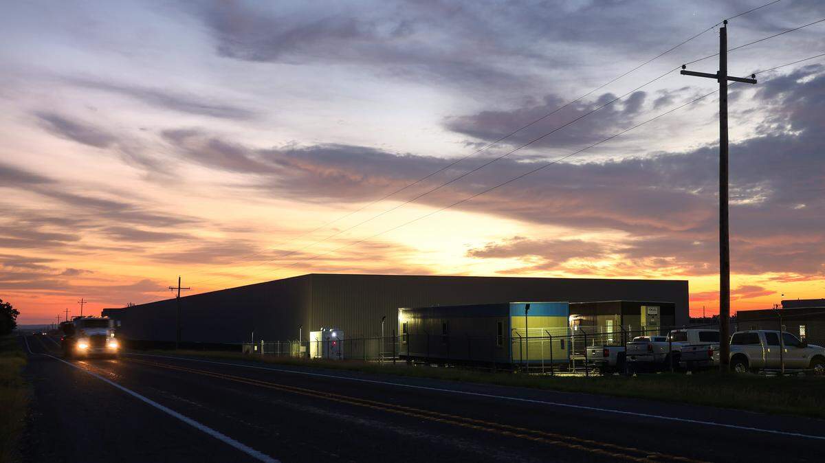 The sun rises on a cryptocurrency mine owned by MARA Holdings on Mitchell Bend Highway on Wednesday, Oct. 8, 2025.