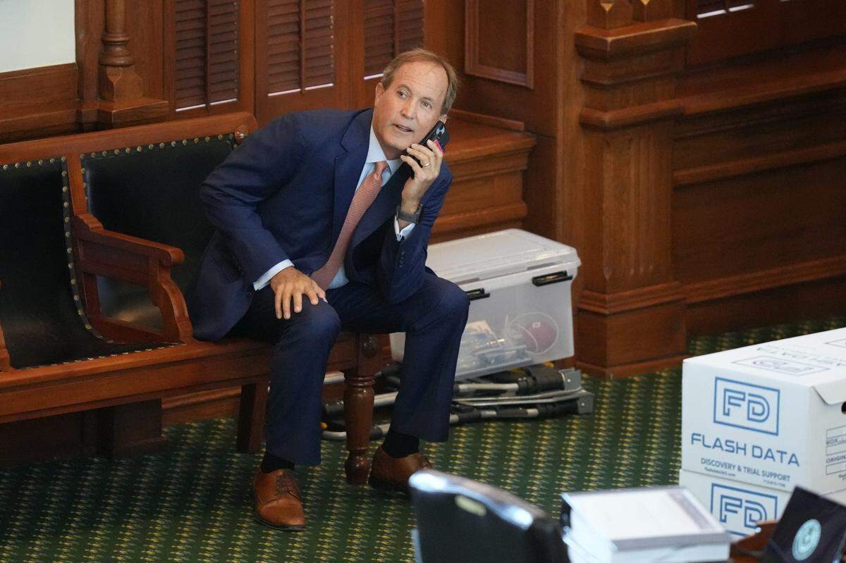 Ken Paxton arrives on the Senate floor for his impeachment trial Tuesday, Sept. 5, 2023, at the Capitol in Austin. The trial will determine if the suspended Attorney General will be removed from office.