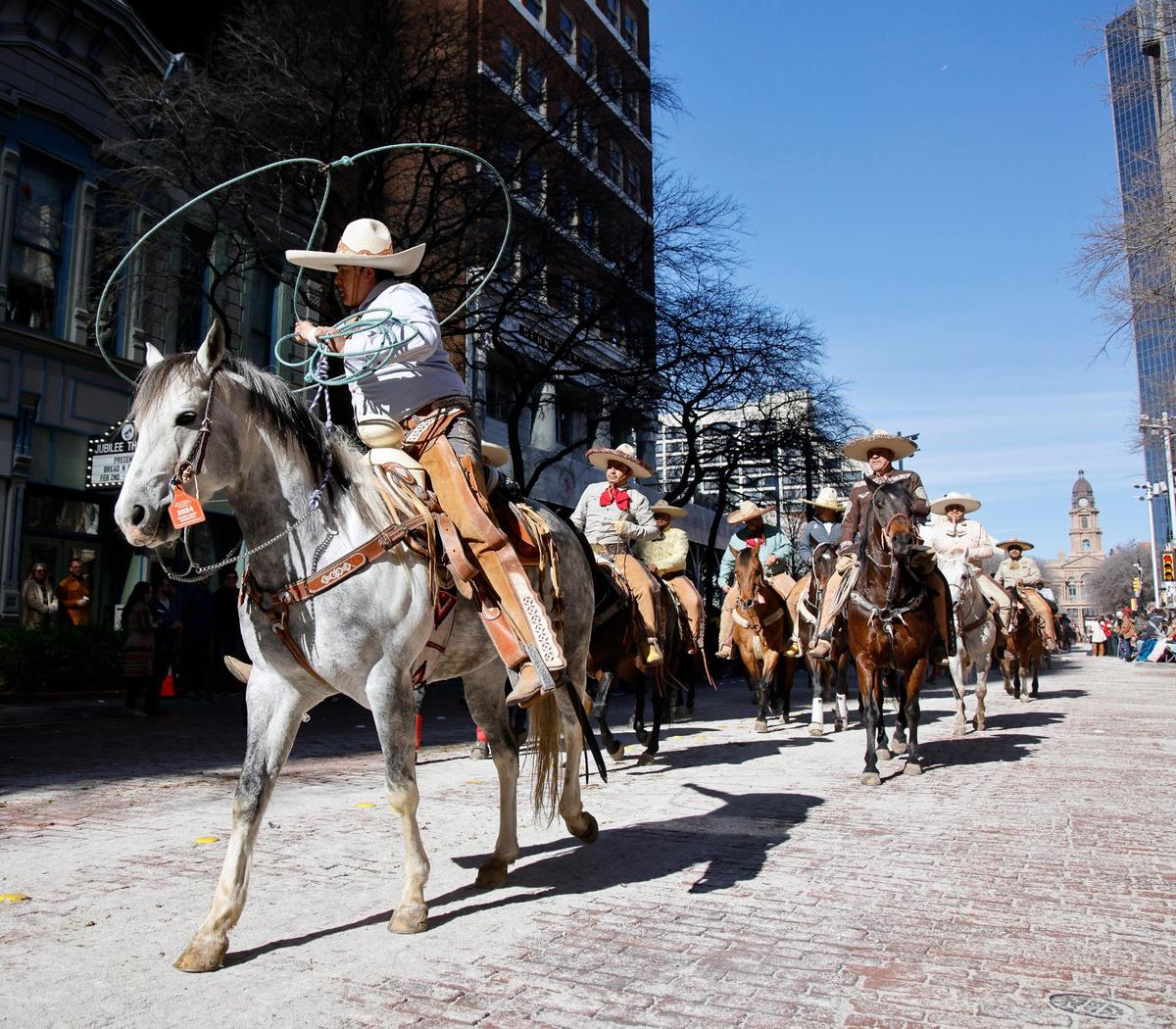 A vaquero shows off his mastery of the lariat during the Fort Worth Stock Show and Rodeo parade in Fort Worth, Texas, Saturday, Jan, 13, 2024. (Special to the Star-Telegram Bob Booth)