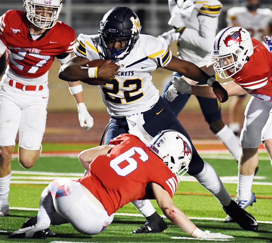 Grapevine’s Drew Nelson, left, and Major Heckt, bottom, try to stop Arlington Heights’ Brian Furch as he rushes his way into the end zone to cut the Mustang lead to final score of 28-7 in the fourth quarter of Friday’s October 28, 2022 District 4-5A Division 2 football game at Mustang-Panther Stadium in Grapevine, Texas. Special/Bob Haynes