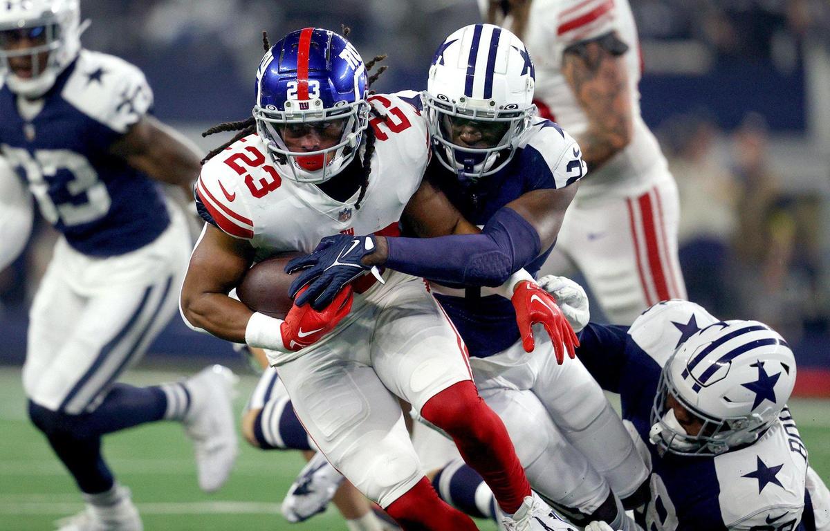 Dallas Cowboys safety Jayron Kearse tackles New York Giants running back Gary Brightwell on Thursday, November 24, 2022, at AT&T Stadium in Arlington.