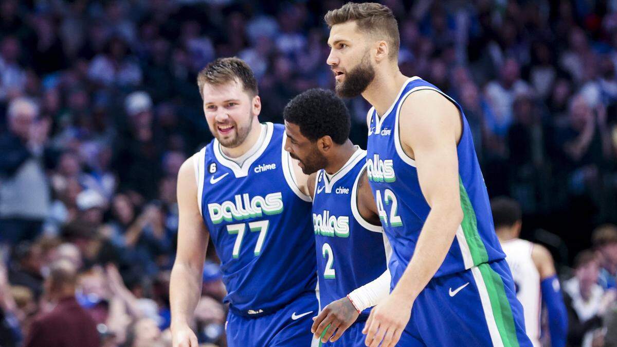 Dallas Mavericks guard Luka Doncic (77) and Dallas Mavericks guard Kyrie Irving (2) and Dallas Mavericks forward Maxi Kleber (42) celebrate a February win, one of the few they’ve had since Irving arrived.