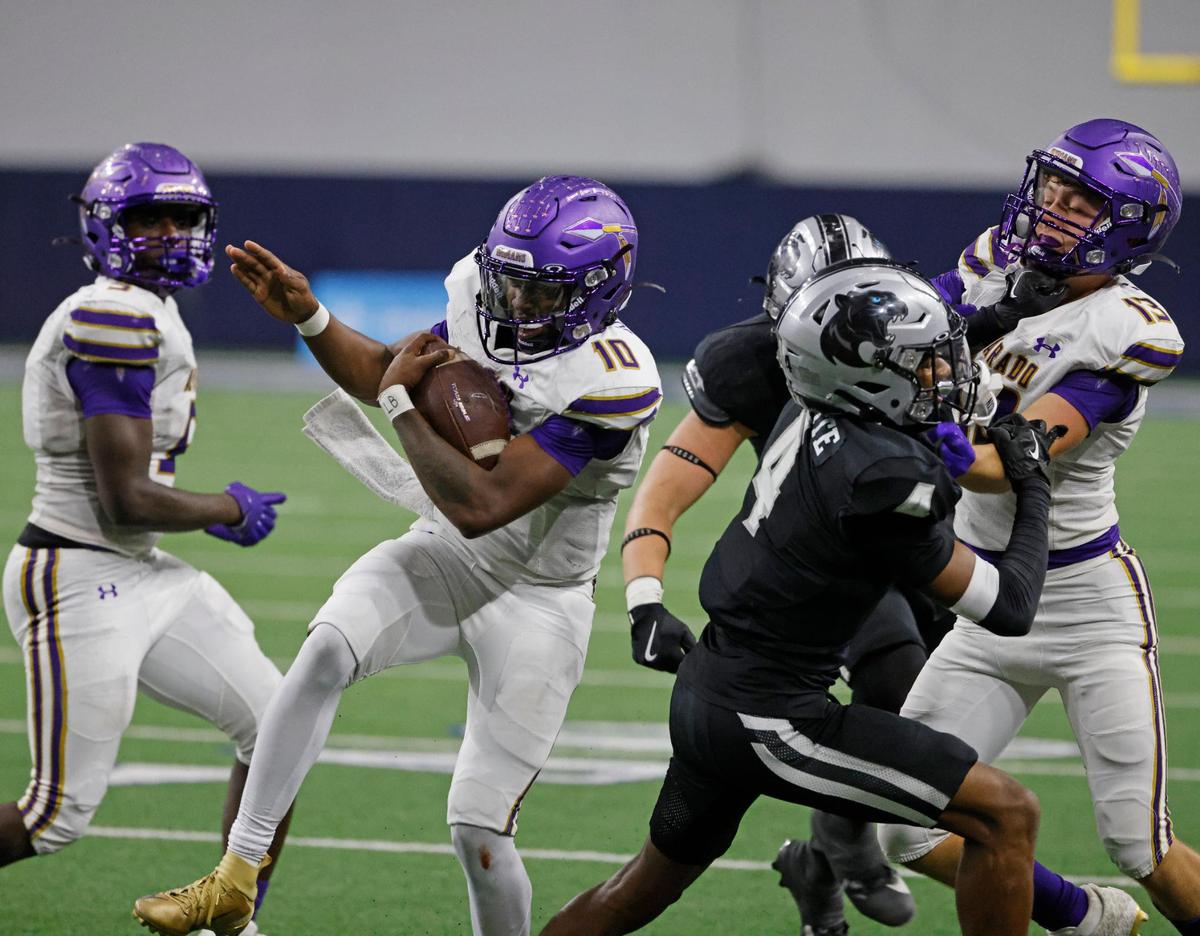 Alvarado quarterback Cardea Collier (10) cuts in behind the defense of Panther Creek defensive backs Seth Jackson (3) and Elyon White (4) during a UIL 4A D1 Area round football playoff game at The Ford Center in Frisco Texas, Thursday, Nov. 21, 2024.