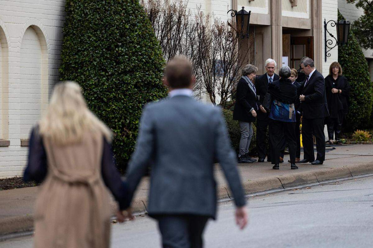 Attendees make their way into the church for the Muckleroy family funeral service at University Christian Church in Fort Worth on Friday.
