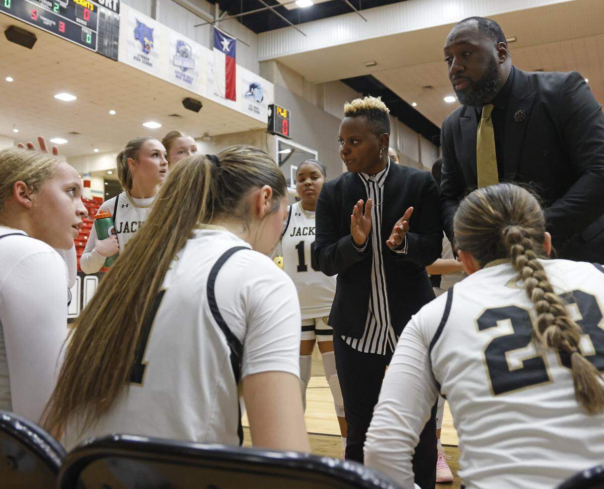 Cleburne head coach Tiffany Hill encourages her team against Arlington Heights during a time out in the first half of the UIL 5A D1 girls bi-district championship basketball game at Wilkerson Greines Activity Center in Fort Worth, Texas, Monday Feb. 16, 2026.