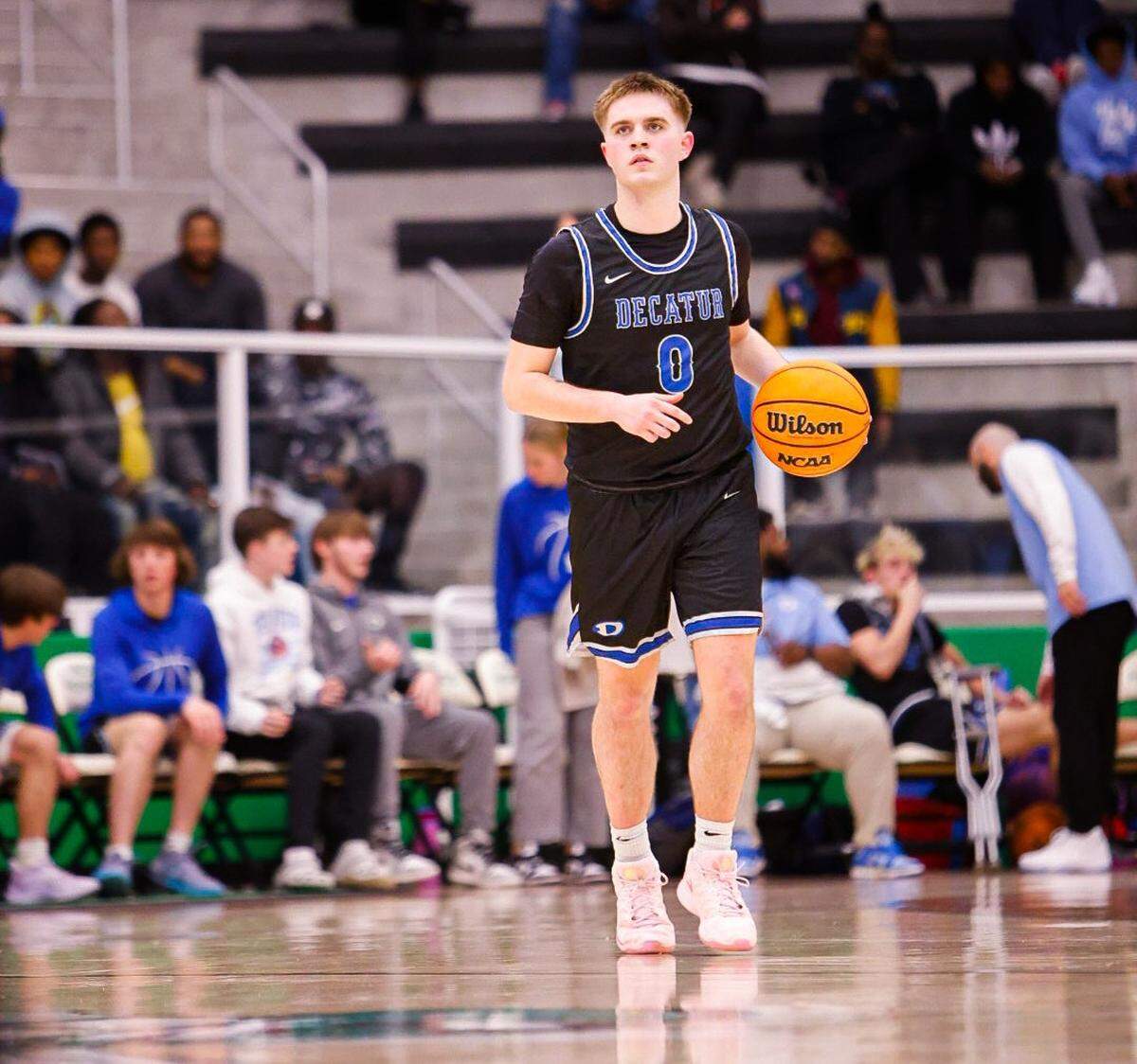 Decatur’s Brayden Shook brings the ball up the court against Fort Worth Eastern Hills in a Class 4A Division 1 bi-district game on Monday, February 17, 2025 at Azle High School. Decatur won 65-63 in overtime.