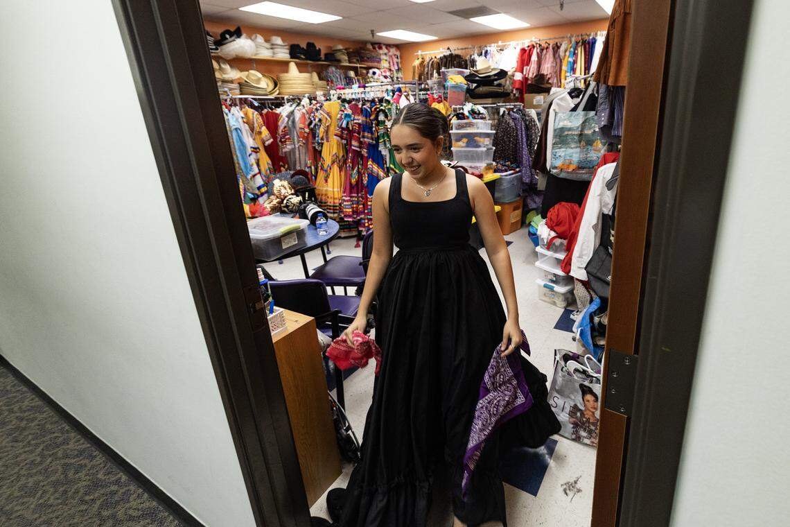 Madeline Vordokas comes out of the dressing room during practice with other members of Ballet Folklorico Azteca de Fort Worth at La Gran Plaza. Ballet Folklorico Azteca celebrates its 50th anniversary this year, marking five decades of sharing and preserving rich Mexican culture through vibrant dance in the city.