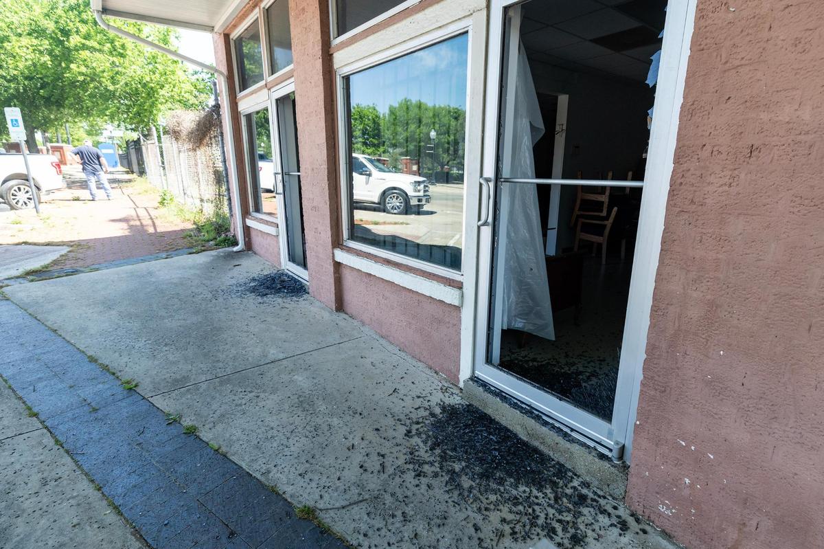 Broken glass remains on the floor from one of the vandalized doors of the Fort Worth Tarrant County NAACP building in Fort Worth on Tuesday, April 15, 2025.