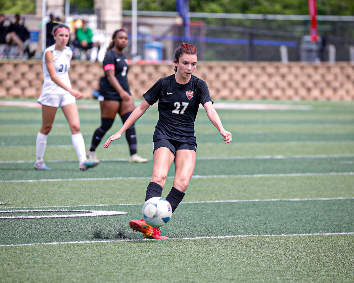 Colleyville Heritage freshman midfielder Brielle McDaniel attacks at Frisco Wakeland defense in a Class 5A state title game at Birkelbach Field on April 13, 2024.