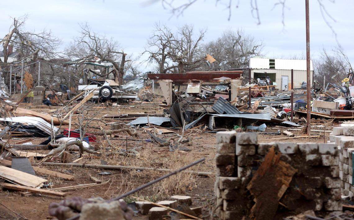 Damaged homes line North 9th Street in Jacksboro on March 22, a day after a tornado ripped through town.