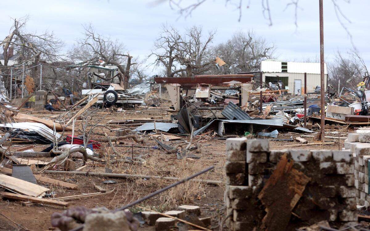 Damaged homes line North 9th Street in Jacksboro on March 22, a day after a tornado ripped through town.