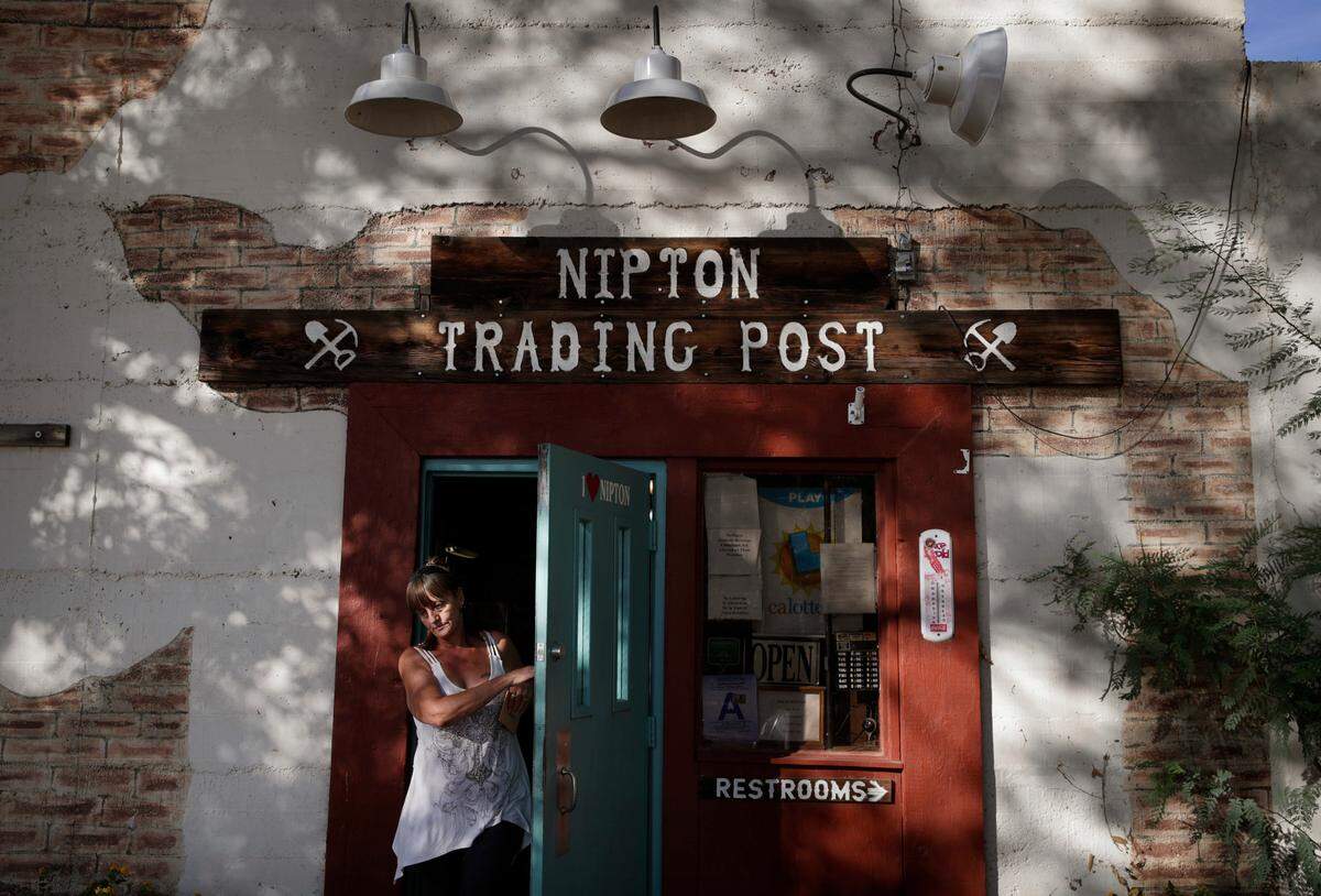 A woman leaves the Nipton Trading Post, Thursday, Aug. 3, 2017, in Nipton, Calif. (AP Photo/John Locher)