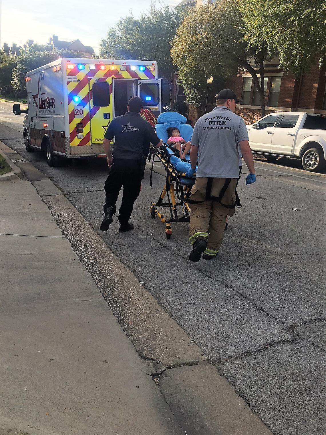 An ambulance takes Elena Lopez away to a hospital after she stopped breathing.