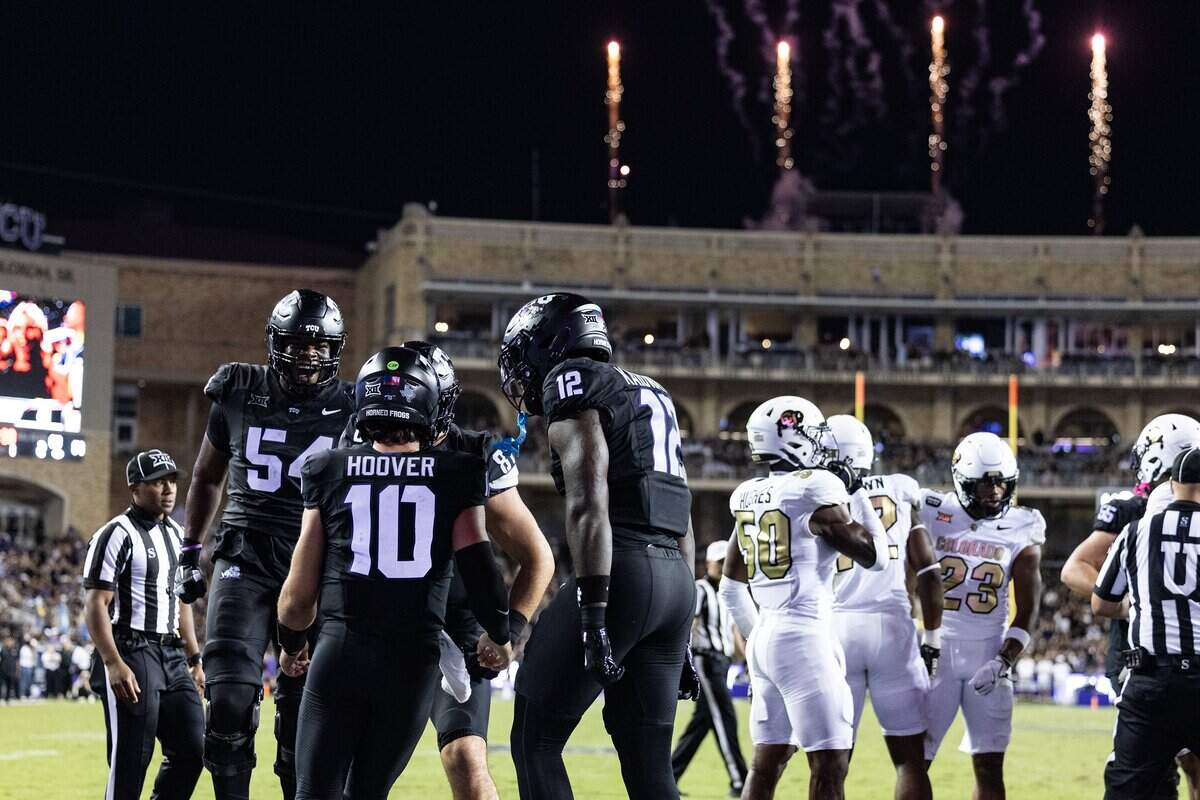 TCU quarterback Josh Hoover (10) celebrates with his teammates after scoring a touchdown in the first half of an NCAA football game between TCU and Colorado at Amon G. Carter Stadium in Fort Worth on Saturday, Oct. 4, 2025.