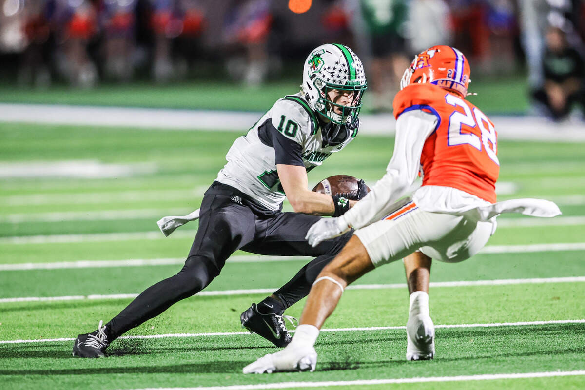 Southlake Carroll receiver Brody Knowles puts a move on San Angelo Central’s Michael Duran (28) to score in a 6A Division II area playoff game at Art Briles Stadium in Stephenville, Friday, Nov. 21, 2025.