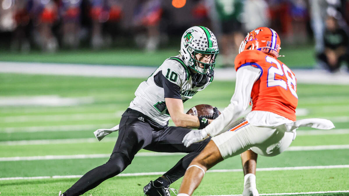 Southlake Carroll receiver Brody Knowles puts a move on San Angelo Central’s Michael Duran (28) to score in a 6A Division II area playoff game at Art Briles Stadium in Stephenville, Friday, Nov. 21, 2025.