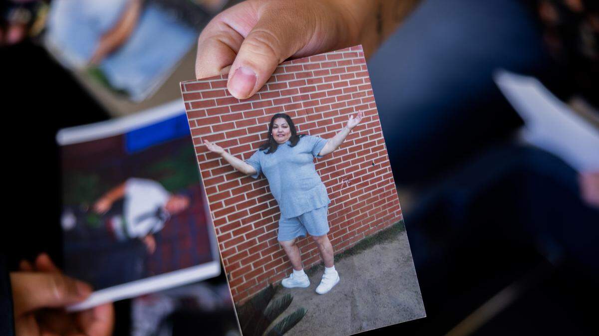 A photo of Martha Perez is found in a bin of family photos at her family's home in Prescott Valley, Arizona, on Sunday, March 9, 2025.