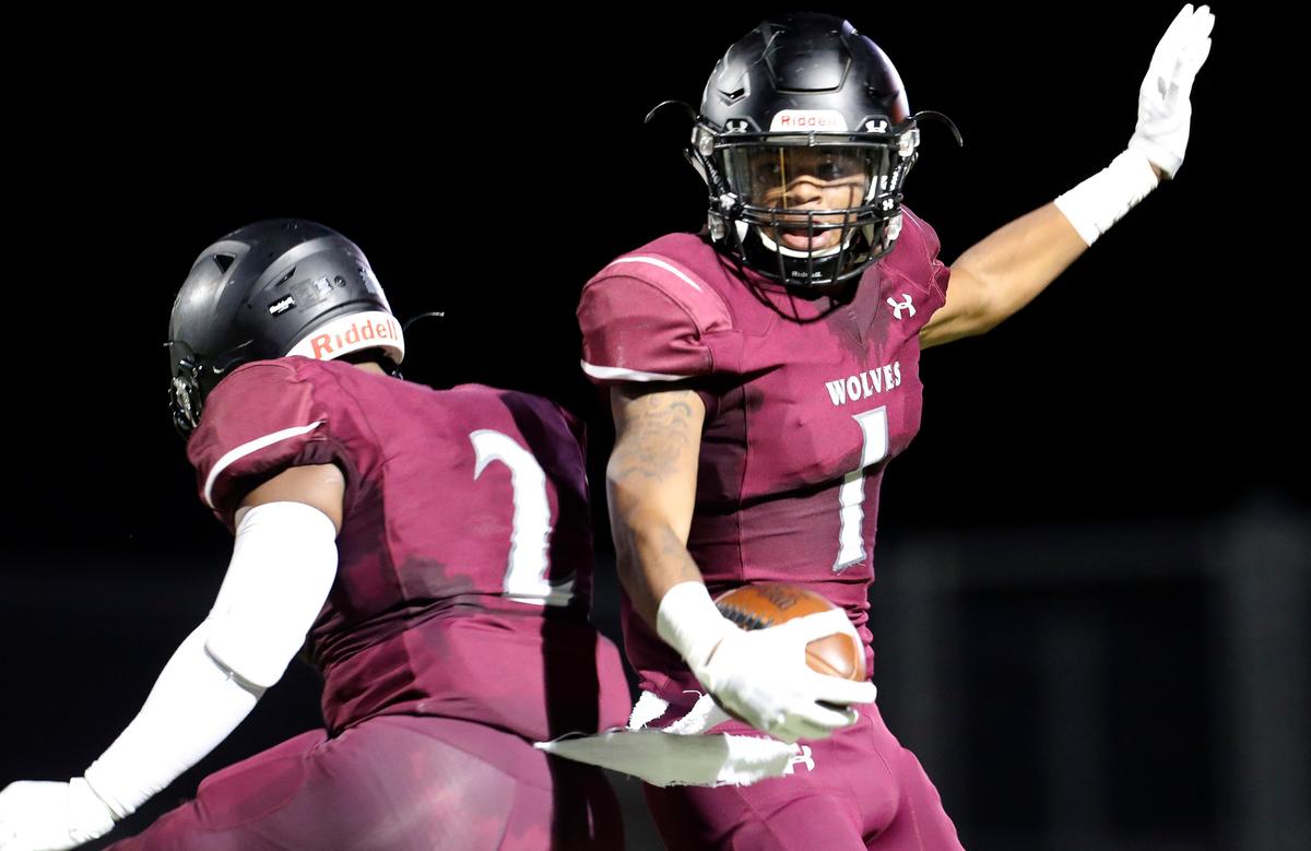 Timberview running back Stacy Sneed (1) celebrates his touchdown with running back Deuce Jones (2) during the first half of a high school football game at Vernon Newsom Stadium in Mansfield, Texas, Friday, Sept. 13, 2019. Timberview led 37-17 at the half. (Special to the Star-Telegram Bob Booth)