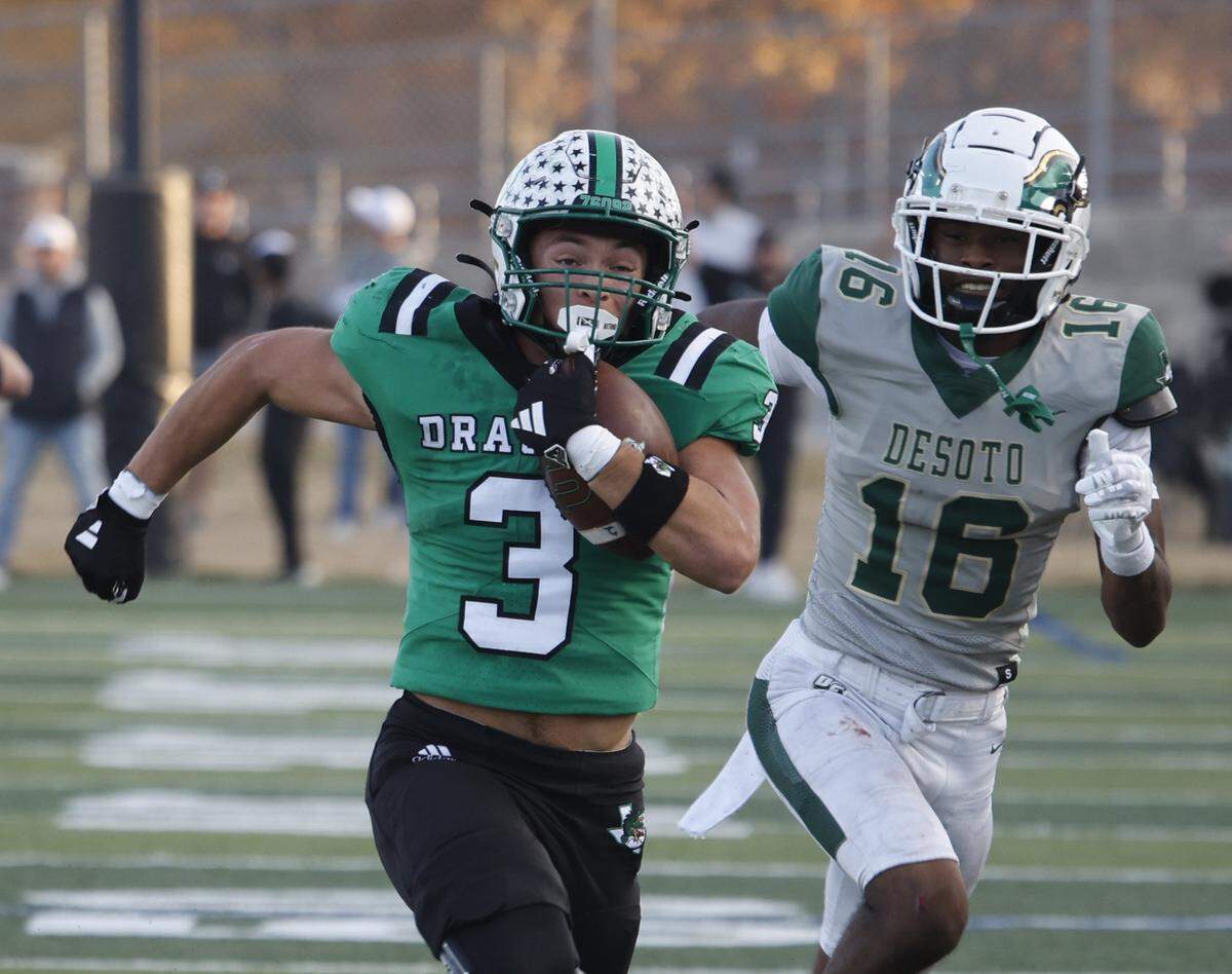 Southlake Carroll running back Davis Penn outruns DeSoto free safety Rickshown Hanks for a touchdown during the second half of a Class 6A Division II state semifinal Saturday at Newsom Stadium in Mansfield.