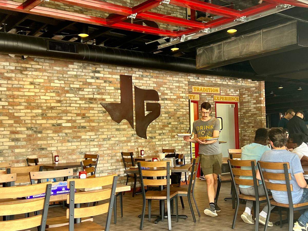 The new Jon’s Grille has sliding windows that open onto West Berry Street.
