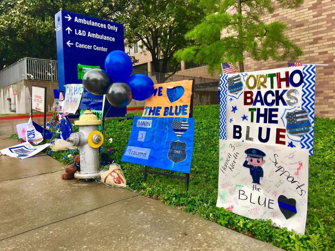 Members of the community started a memorial outside Texas Health Presbyterian Hospital in Dallas. One Dallas police officer, Rogelio Santander, was killed and another female officer and a loss-prevention officer were both critically injured during a shooting at Home Depot on April 24.