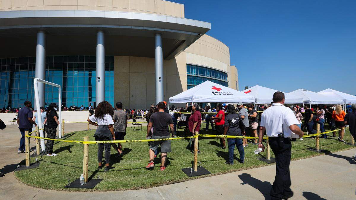 Parents waited in a long line to pick up their children at the Mansfield school district’s Center for Performing Arts after a shooting at Timberview High School on Wednesday.