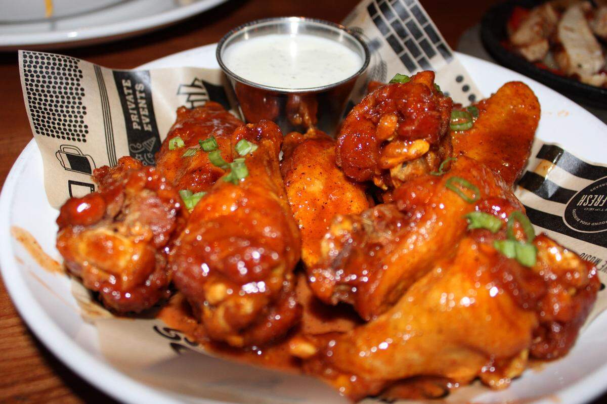 Flips 24kt Gold Traditional Wings. They also offer boneless wings with flavors like mild, hot, mango habanero, chipotle BBQ, 24kt gold, parmesan garlic, spicy garlic or lemon pepper.