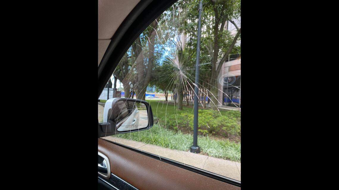 Lauren Drum says the lawn mower blade struck the passenger side window next to her after breaking through the windshield.