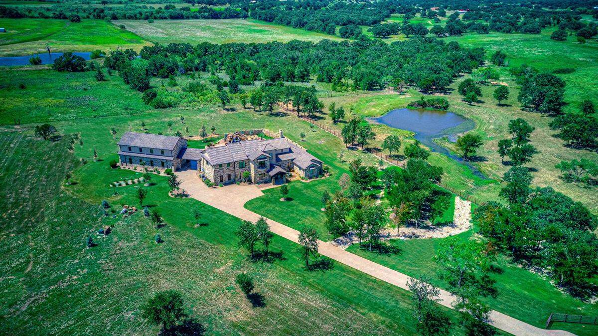 The home at 2067 Doss Road is ultra-energy efficient and offers views of a creek, pond and green countryside. 