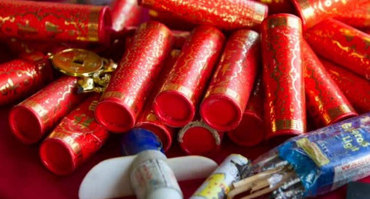 Red firecrackers with gold designs.