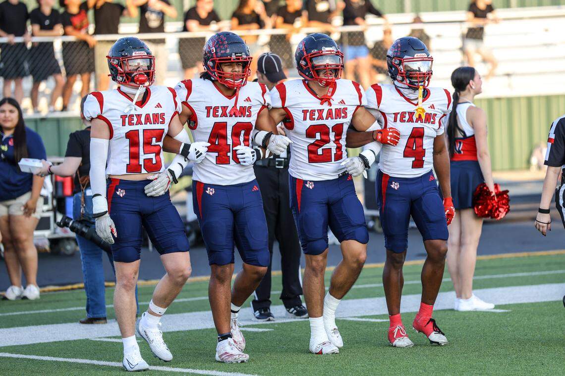 The Northwest High School captains take the field before  Friday’s District 4-6A game at Keller ISD Stadium. Tom Marvin / Special to the Star-Telegram