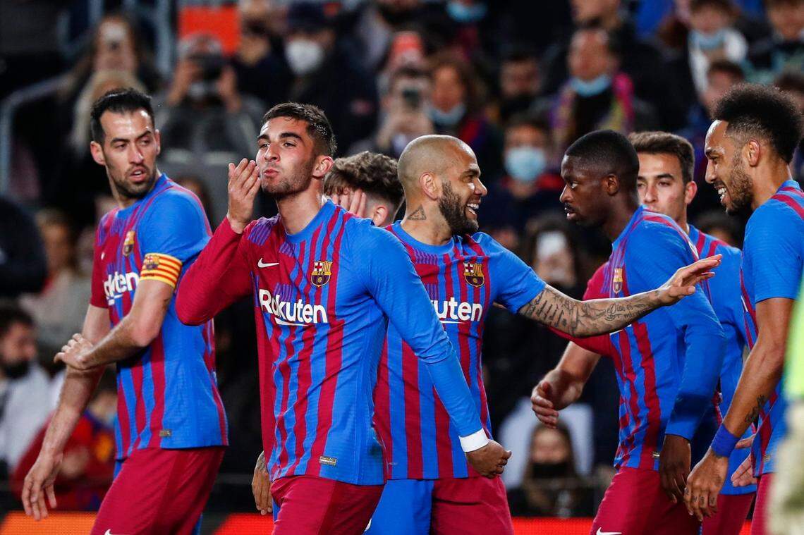 FC Barcelona’s players celebrate a goal during a Spanish La Liga soccer match between FC Barcelona and Osasuna at the Camp Nou stadium in Barcelona, Spain, Sunday, March 13, 2022. (AP Photo/Joan Monfort)