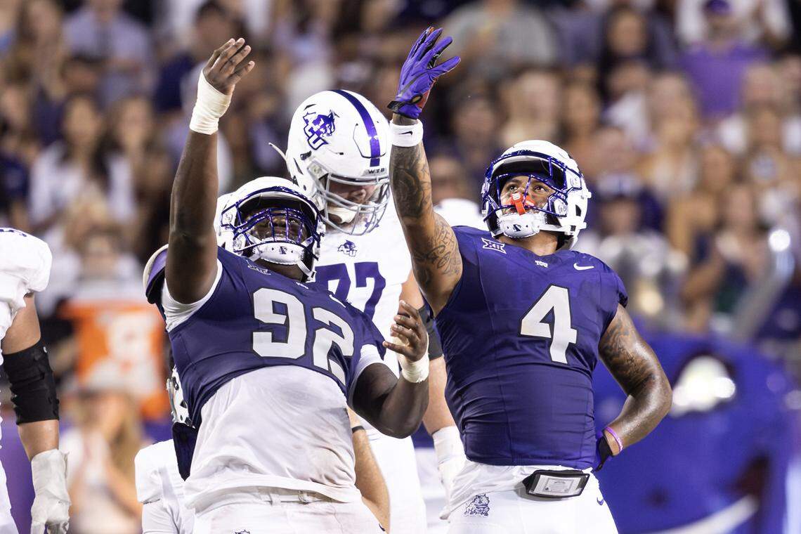 TCU linebacker Namdi Obiazor (4) and defensive tackle Ansel Din-Mbuh (92) celebrates after getting a sack on Abilene Christian quarterback Stone Earle (4) in the first half of an NCAA game between TCU and Abilene Christian at Amon G. Carter Stadium in Fort Worth on Saturday, Sept. 13, 2025.
