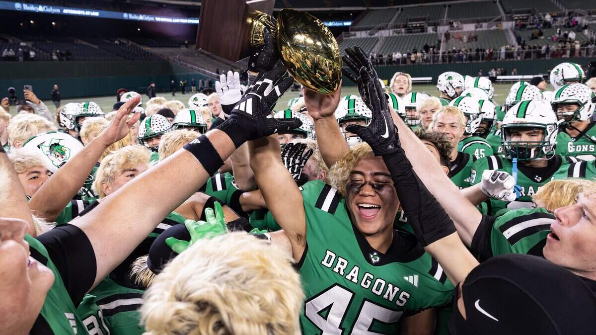 The Southlake Carroll football team celebrates after winning the UIL Division II Regional playoff game 49-31 against Prosper at Choctaw Stadium in Arlington on Friday, Nov. 28, 2025.