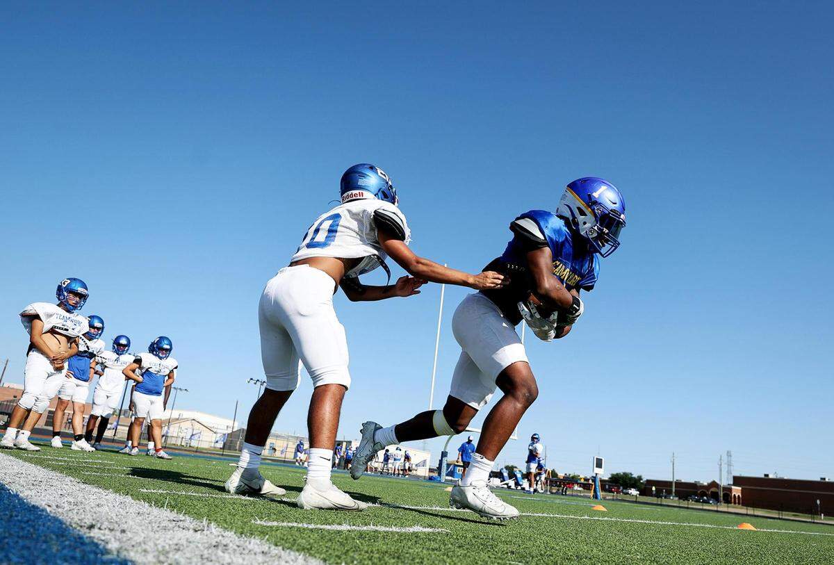 Venus High running back Damarie Bell runs a drill during practice. The Bulldogs, with the help of Bell, are having one of their best seasons in years.