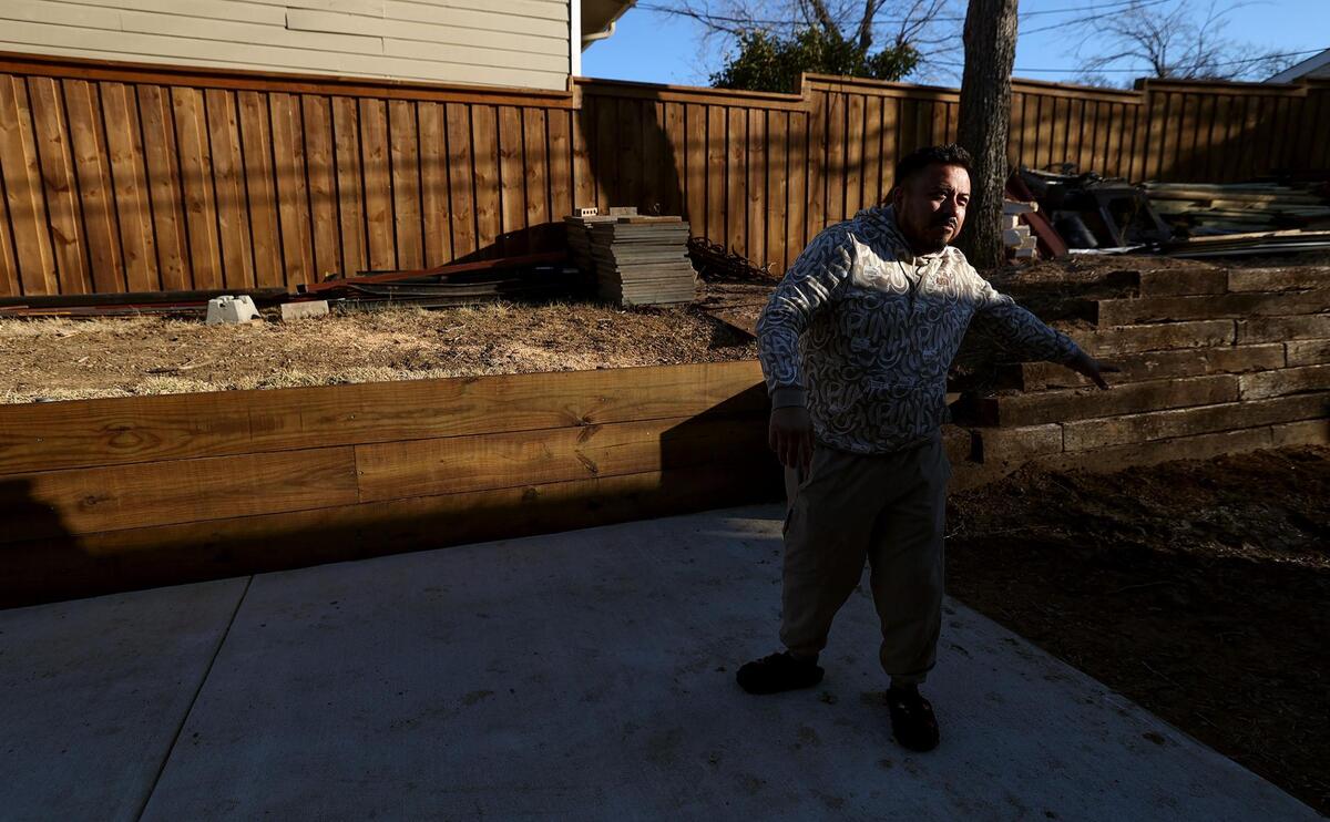 Martinez shows the extension of his driveway on Thursday, Jan. 16, 2025. The city’s Historic and Cultural Landmarks Commission ordered him to remove it a few days earlier.