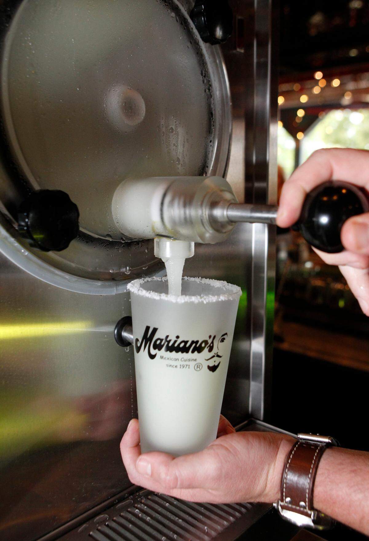 A frozen margarita is dispensed at Mariano’s in Dallas. Mariano Martinez invented the frozen margarita machine 41 years ago. (Vernon Bryant/The Dallas Morning News/MCT)
