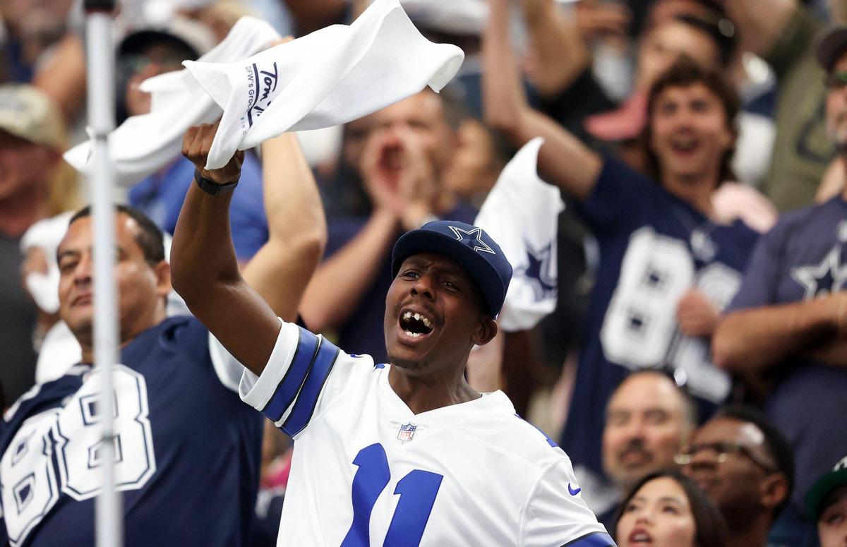 A Dallas Cowboy fan cheers during the second half against the Washington Commanders on Sunday, October 2, 2022.